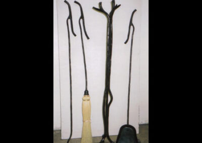 Branch fireplace tools by Live Iron Forge.