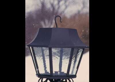 Hanging candle lantern by Live Iron Forge.